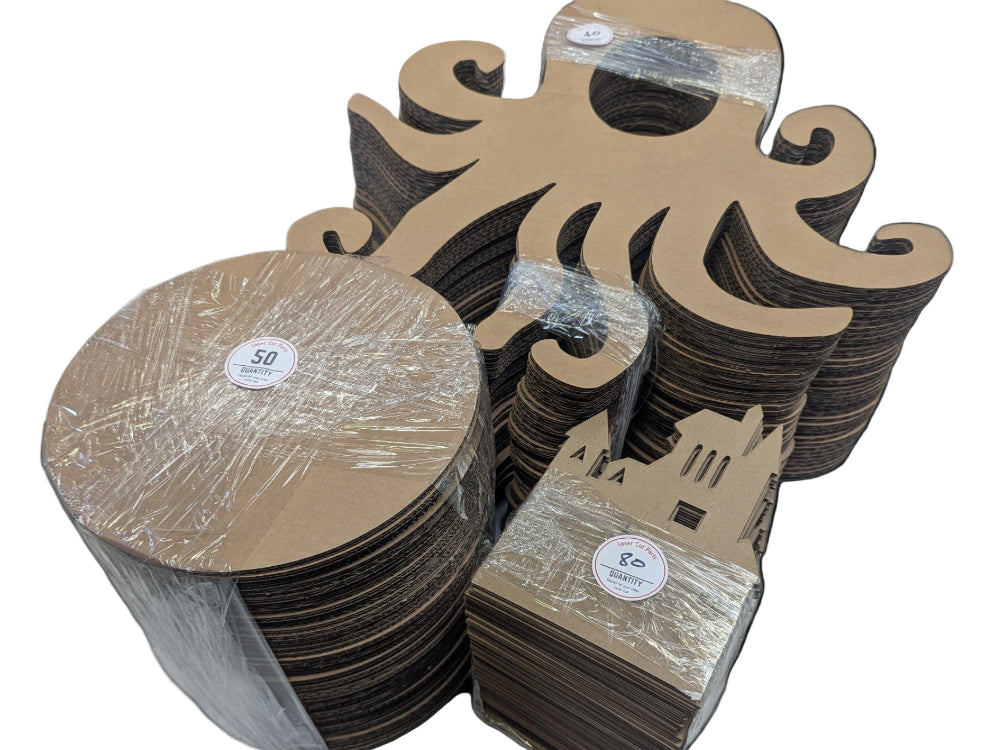 Stacks of cardboard cutouts with packaging on a white background