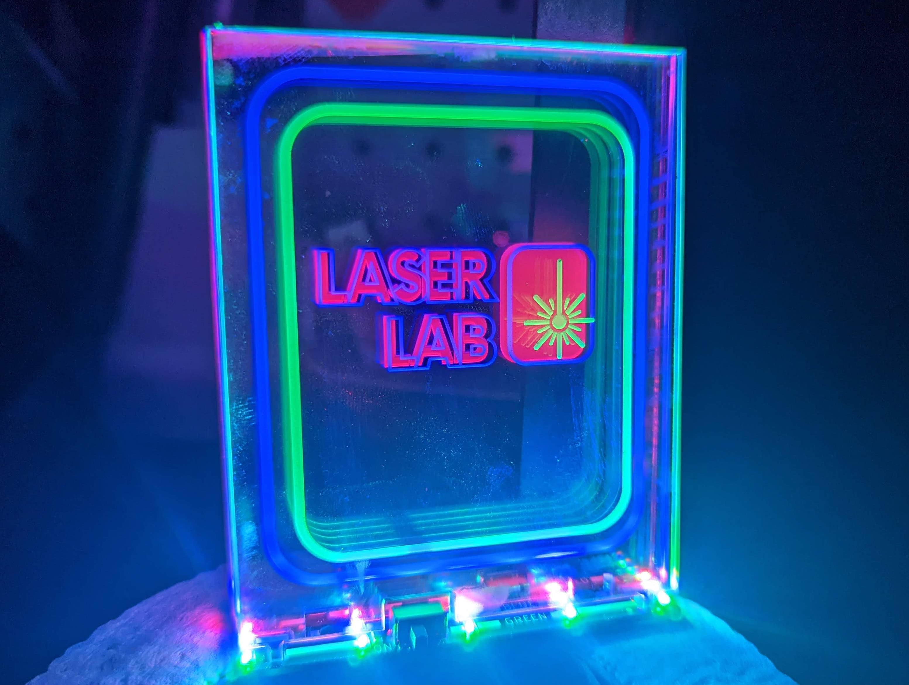Neon sign with 'Laser Lab' text on celar acrylic